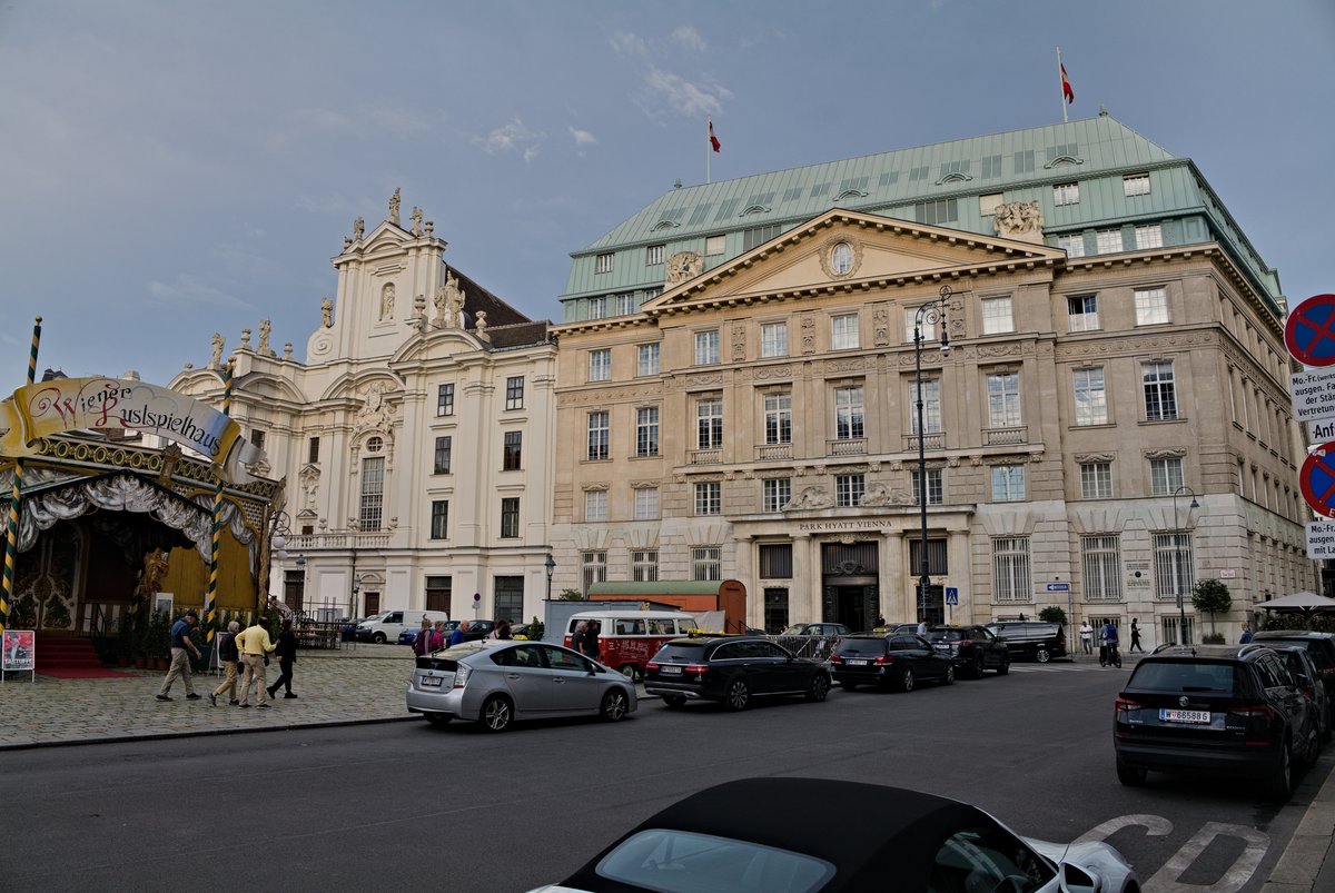 View of Am Hof street in Vienna with historic buildings and pedestrians on a sunny day