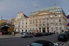 View of Am Hof street in Vienna with historic buildings and pedestrians on a sunny day
