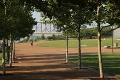 Bicyclist biking north on the Arch grounds in St. Louis