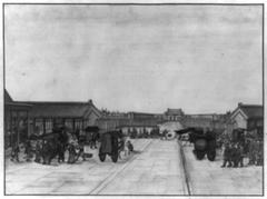 Chinese bazaar in plaza before Buddhist temple with people arriving by carriage, cart, and on foot