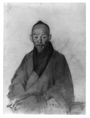 Elderly Chinese man seated, holding pipe, three-quarter length portrait