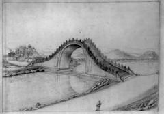 High arched pedestrian bridge spanning river in China