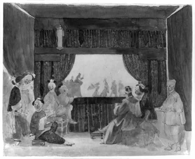 Adults and children enjoying a shadow puppet show with colorful wall shadow projections