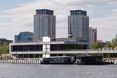 Moscow South River Terminal building with quay alongside the river in spring daylight