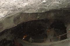 Historic salt mine tunnels in Wieliczka, Poland with visitors inside