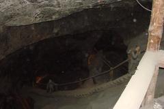 Wieliczka salt mine underground chamber with wooden support beams and historic mining equipment