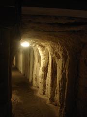 Wieliczka Salt Mine underground chamber with intricate salt formations and lighting in Poland