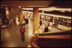 Arrivals and departures at an underground station with escalators