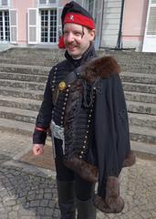 Man wearing a traditional pelisse trimmed with dyed possum fur at the Düsseldorf Baroque Festival Schloss Benrath