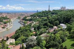 Scenic view of the Saône River entering the center of Lyon with Fourvière hill on the right and distant peaks of Part-Dieu towers