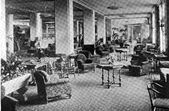 Interior view of the main lobby of the Ambassador Hotel in 1921 with elegant furnishings and people