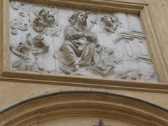 Close-up of a decorative bas-relief above the entrance to St. Martin's Church in Warsaw