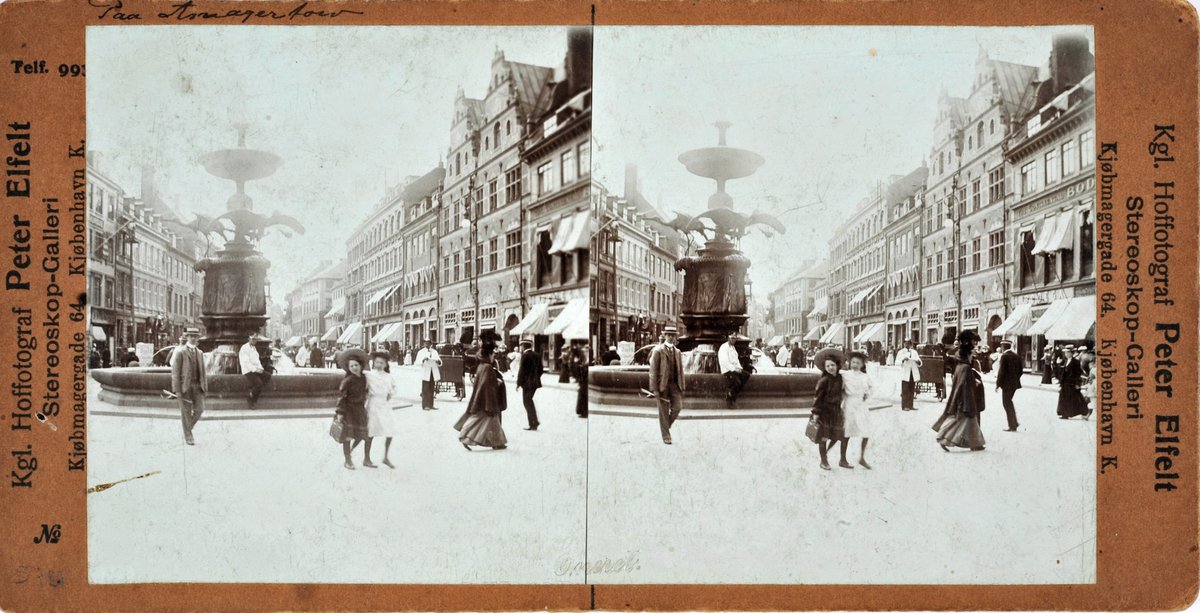 Amagertorv square in Copenhagen in 1903 with historic buildings and horse-drawn carriages