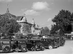 Vintage cars parked in front of the Grand Palais during the 29th Salon de l'automobil in Paris 1935