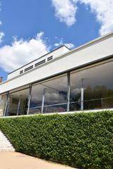 Villa Tugendhat exterior view with modernist architecture and well-maintained garden