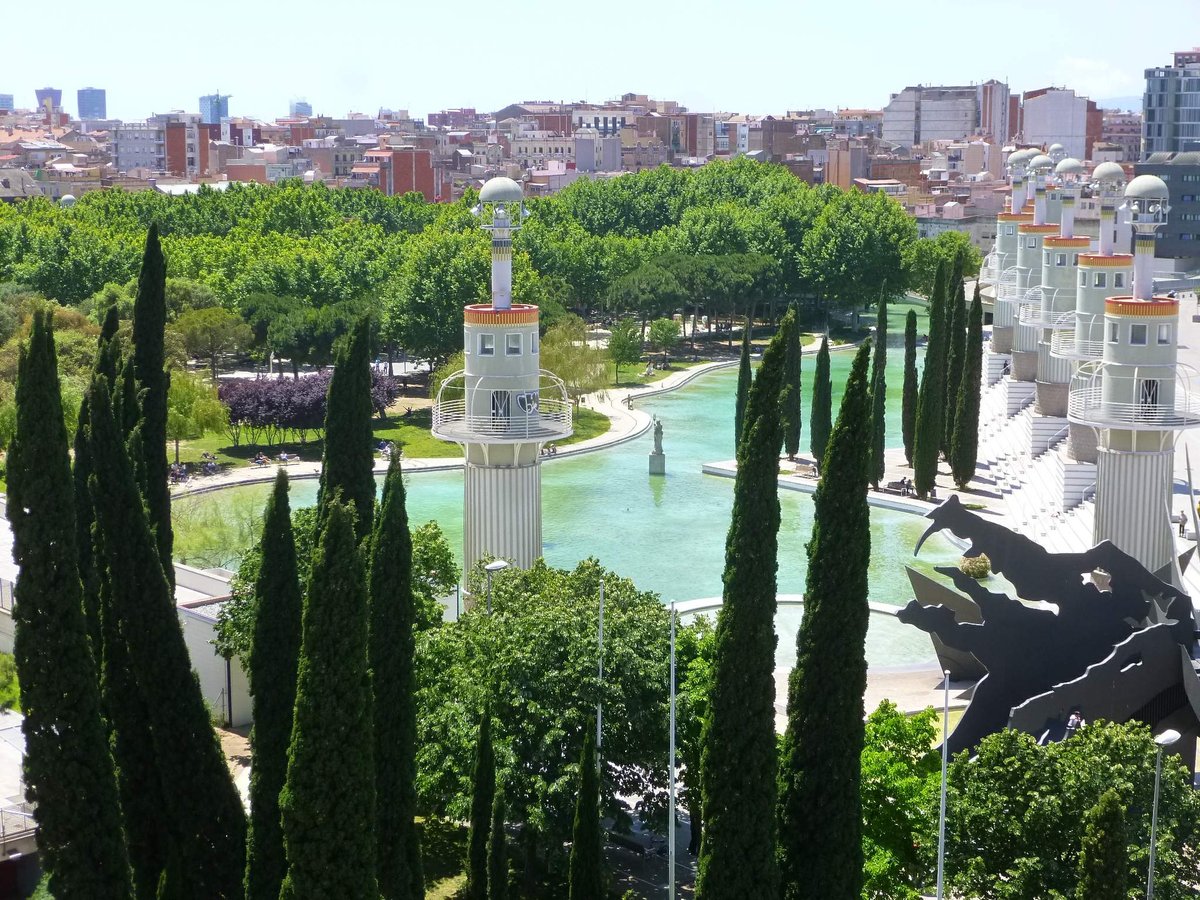 Barcelona Parc de l'Espanya Industrial with modern architecture, water features, and greenery