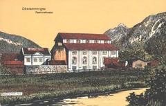 Passionstheater theater building in Oberammergau with mountains in the background