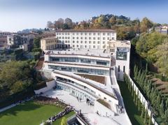 Aerial view of University of Bergamo Pignolo campus with historic buildings and greenery