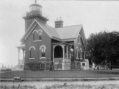 Belle Isle Lighthouse built in 1881 standing on rocky shoreline