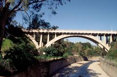 Open spandrel arch concrete bridge with Beaux Arts architectural style over the Arroyo Seco in California