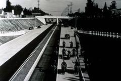Historic black and white photograph of Arroyo Seco Parkway Cut in California with two-toned concrete and asphalt paving, captured on opening day in 1940
