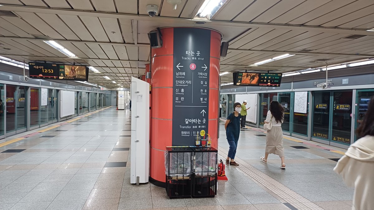 Seoul Subway Line 8 Bokjeong Station platform with signs and tracks