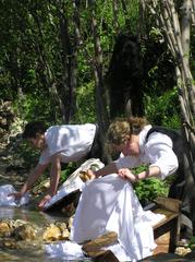 Women washing clothes outdoors in Romano d'Ezzelino