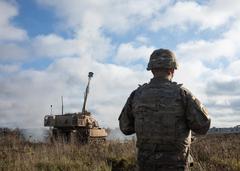 U.S. Army Sgt. 1st Class Brandon Cass observing an M109A7 Paladin howitzer during Exercise Wawel Dragon at Bemowo Piskie Training Area in Poland