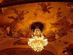 Ornate ceiling and chandelier inside the Großes Haus of Hessisches Staatstheater Wiesbaden before opera Turandot