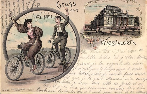 Cyclist with cyclist greeting 'All heil!' in front of Hoftheater Wiesbaden