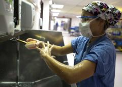 Senior Airman scrubbing in before surgery at Wilford Hall Ambulatory Surgical Center