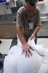 Orthotist instructor building custom back brace for patient at Wilford Hall Medical Center