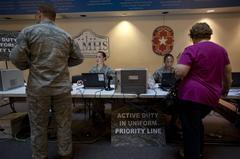 Medical technicians administering flu vaccines at Wilford Hall Ambulatory Surgical Center