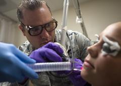 Dr. Chad Hivnor treating patient's scar with fractional CO2 laser at Wilford Hall Ambulatory Surgical Center Texas