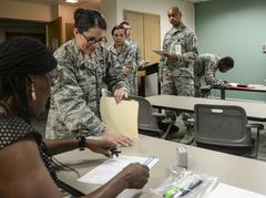 Members of the 59th Medical Wing submitting BAH recertification documents at Wilford Hall Ambulatory Surgical Center