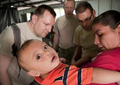Salvadoran infant receives dermatology care from U.S. Air Force medical professionals at a clinic in Caluco, El Salvador during Beyond the Horizon humanitarian exercise, April 15, 2013