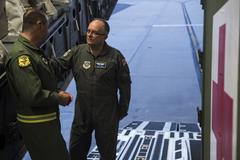 U.S. Air Force Brig. Gen. Lee Payne speaks with Col. Shawn Zarr on flightline during Exercise Mobility Solace
