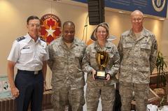U.S. Air Force Maj. Gen. Byron Hepburn presenting Good Catch award to 59th Medical Wing members at Wilford Hall Ambulatory Surgical Center