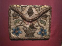 18th century Pennsylvania pocketbook with basket of flowers