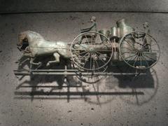 Antique steam fire engine weathervane from circa 1880, displayed at American Folk Art Museum NYC