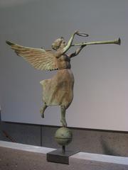Antique Weathervane of Fame with a figure holding a trumpet, American Folk Art Museum NYC