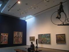 Gallery view inside the American Folk Art Museum in New York City featuring traditional folk art exhibits