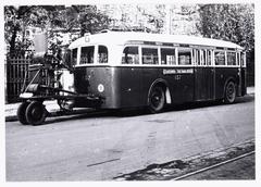 Historic photo of bus line G with wood gas generators at Haarlemmermeerstation, Amstelveenseweg, Amsterdam during WWII circa 1945