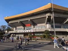 Kitanomaru Park view towards Northern exit showing Budokan arena and surrounding greenery during daytime in Tokyo, Japan