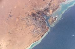 Aerial view of Yanbu' al Bahr city by NASA showing coastal and urban landscape