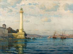Ahırkapı Lighthouse at sunset with calm sea and cloudy sky