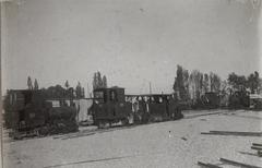 Train traveling near Mount Grappa crossing a valley by an iron bridge