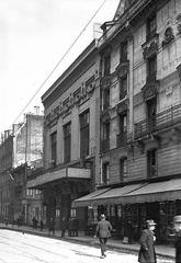 Facade of the Alhambra Theatre with neighboring buildings at 50 to 54 rue de Malte in Paris, France, historic 1925 press photograph