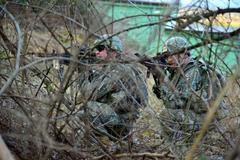 U.S. Army paratroopers patrolling at Longare Complex during day and night training