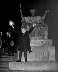 President Dwight D. Eisenhower posing in front of the Alma Mater statue at Columbia University